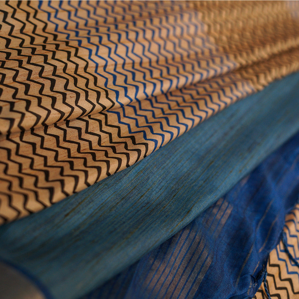Cream And Black Stripe With Blue Border Tussar Saree