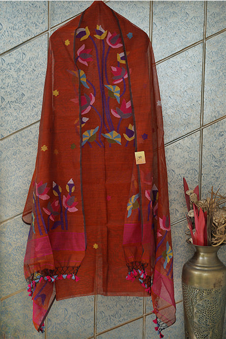 JAMDANI cotton jamdani suit in rust colour with pink blue embroidery and tassels