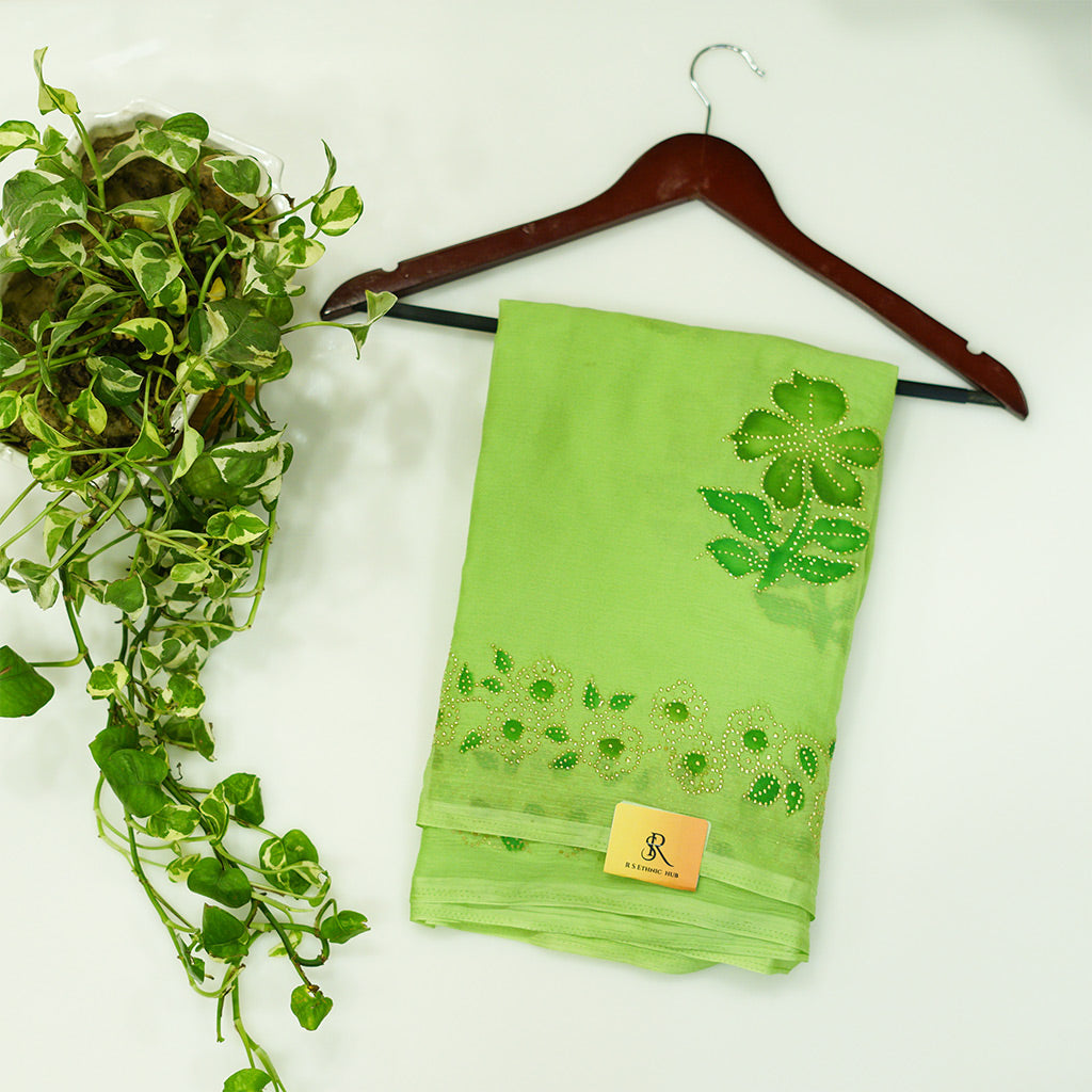 Green chiffon saree with hand paint and golden buttis work all over