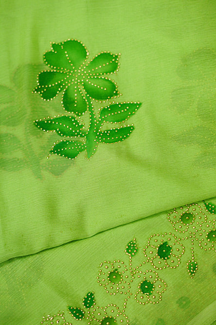 Green chiffon saree with hand paint and golden buttis work all over